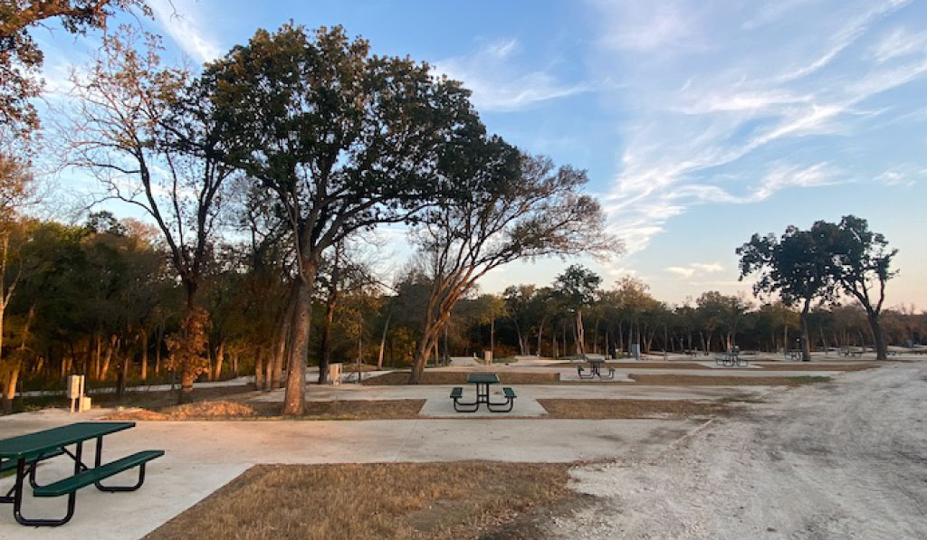 Full Hookup spacious RV sites at The Woods RV and Cabin Resort, nestled in nature for a peaceful and scenic camping experience